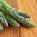 Mary Washington Asparagus grown from seed on a wooden cutting board. 