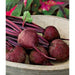 Detroit Dark Red Beets grown from seed tape resting on a bowl.